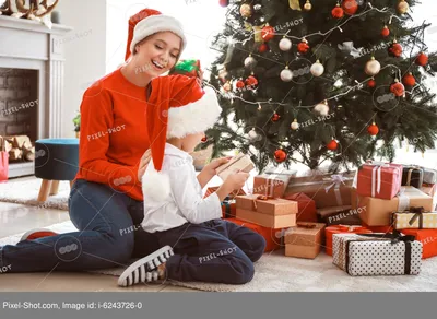 Маленькие девочки играют возле дома возле елки Stock Photo | Adobe Stock