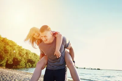 Sensual Woman Sitting On Handsome Boyfriend In Free Stock Photo and Image  370295262